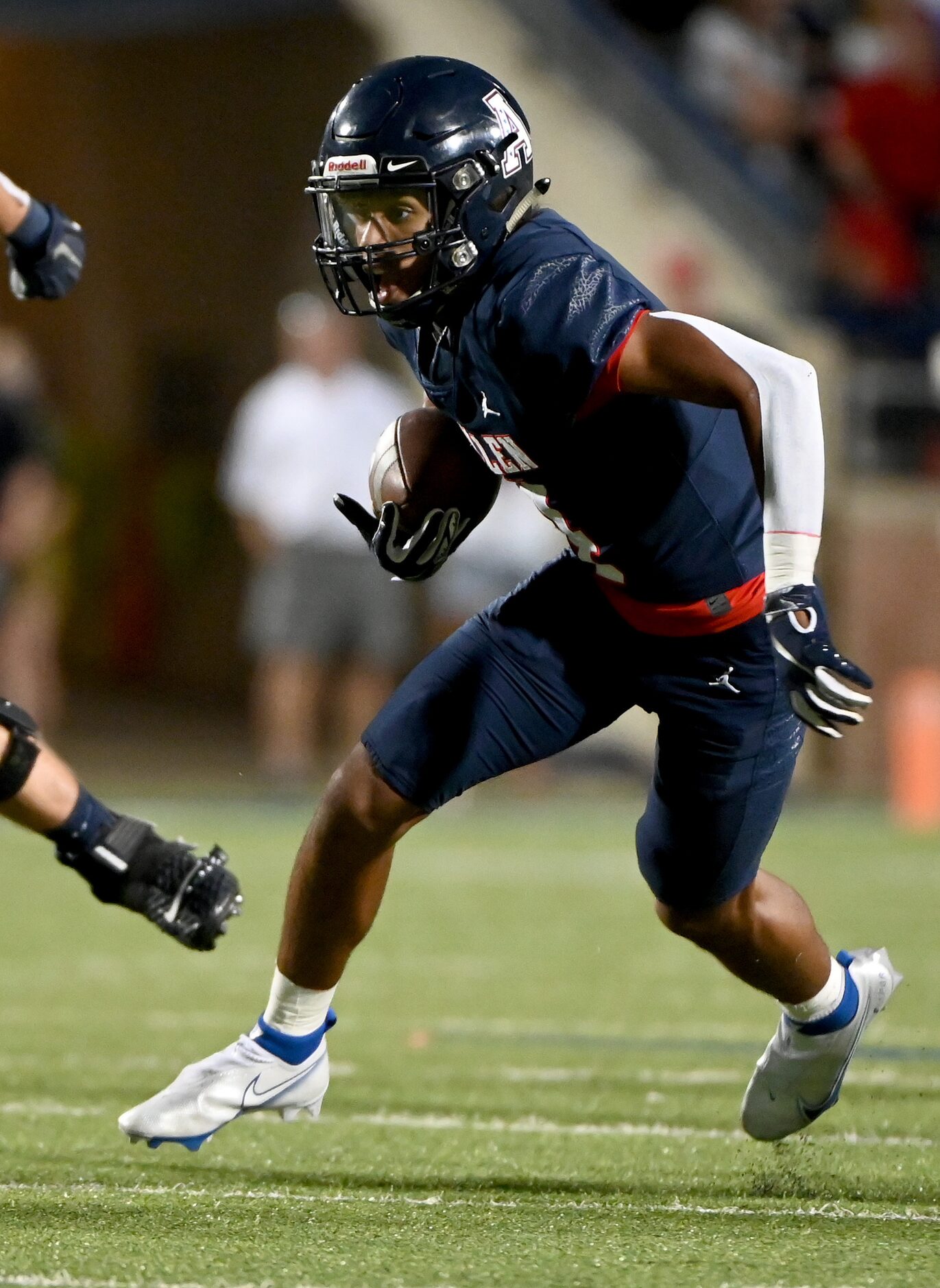 Allen's Jordyn Tyson (4) runs upfield after a catch in the first half of a high school...