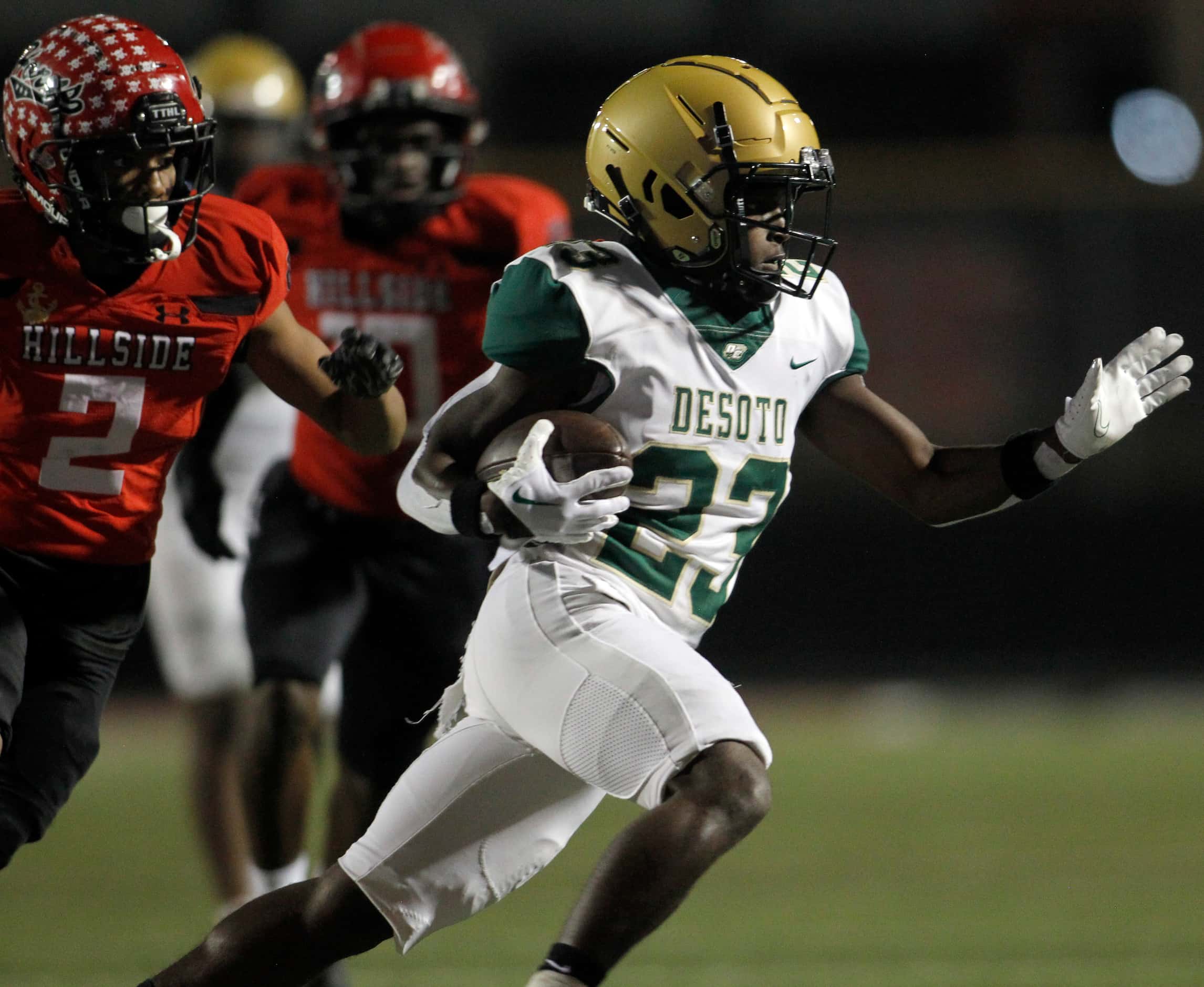 DeSoto running back Jakyree Washington (23) rushes for a long gainer as he is pursued by...