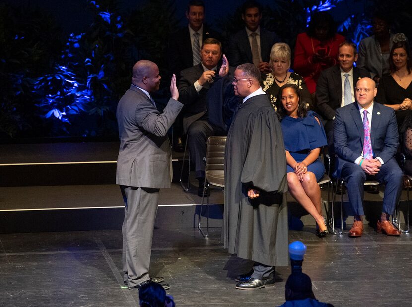 Eric Johnson takes the oath of office as he is sworn in as the new mayor of Dallas by...