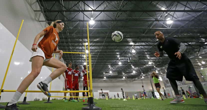 Haley Berg, left, trains with former FC Dallas player Peter Luccin at Performance Indoor...