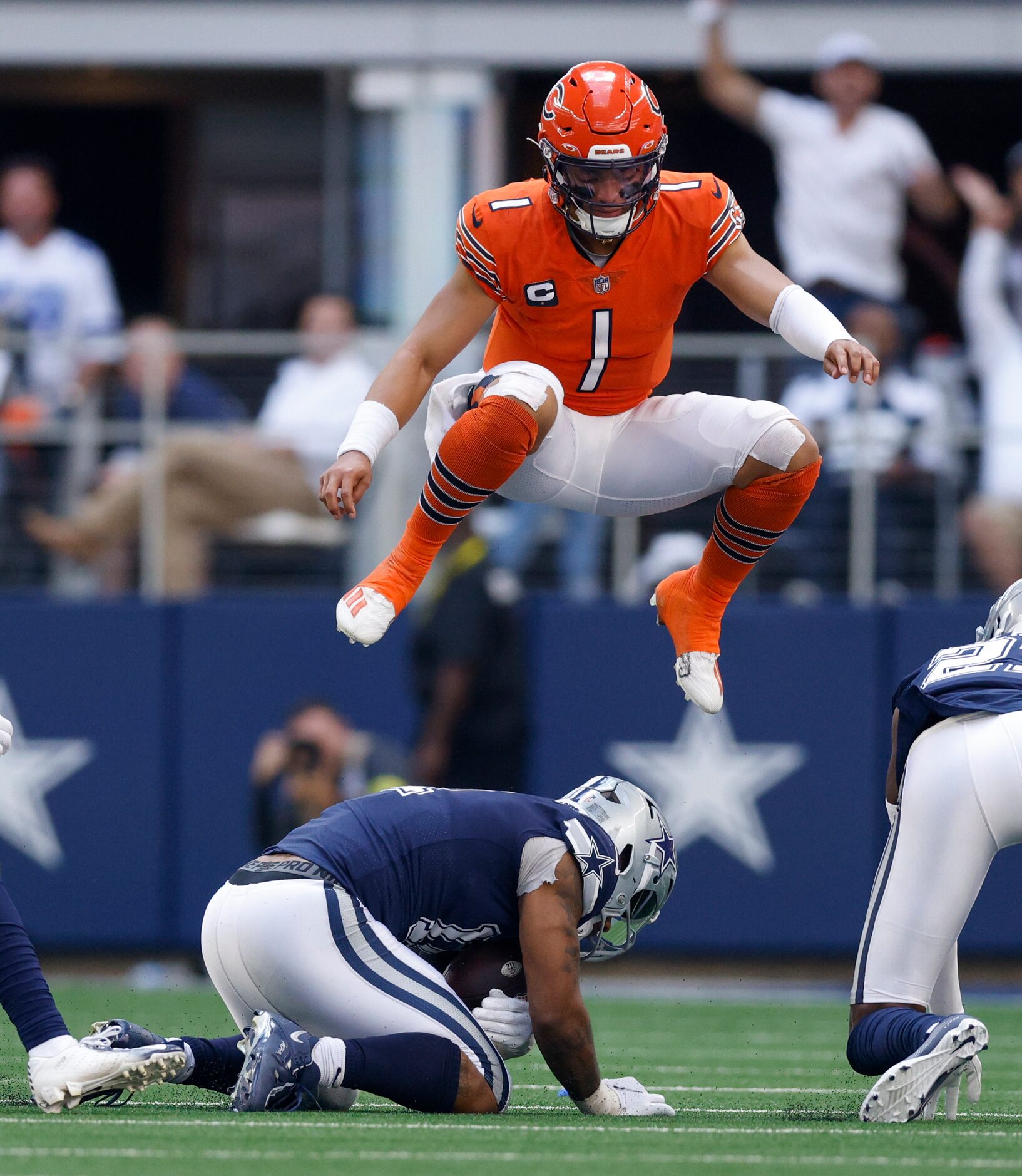 Dallas Cowboys cornerback Kelvin Joseph (1) leaps over Dallas Cowboys linebacker Micah...