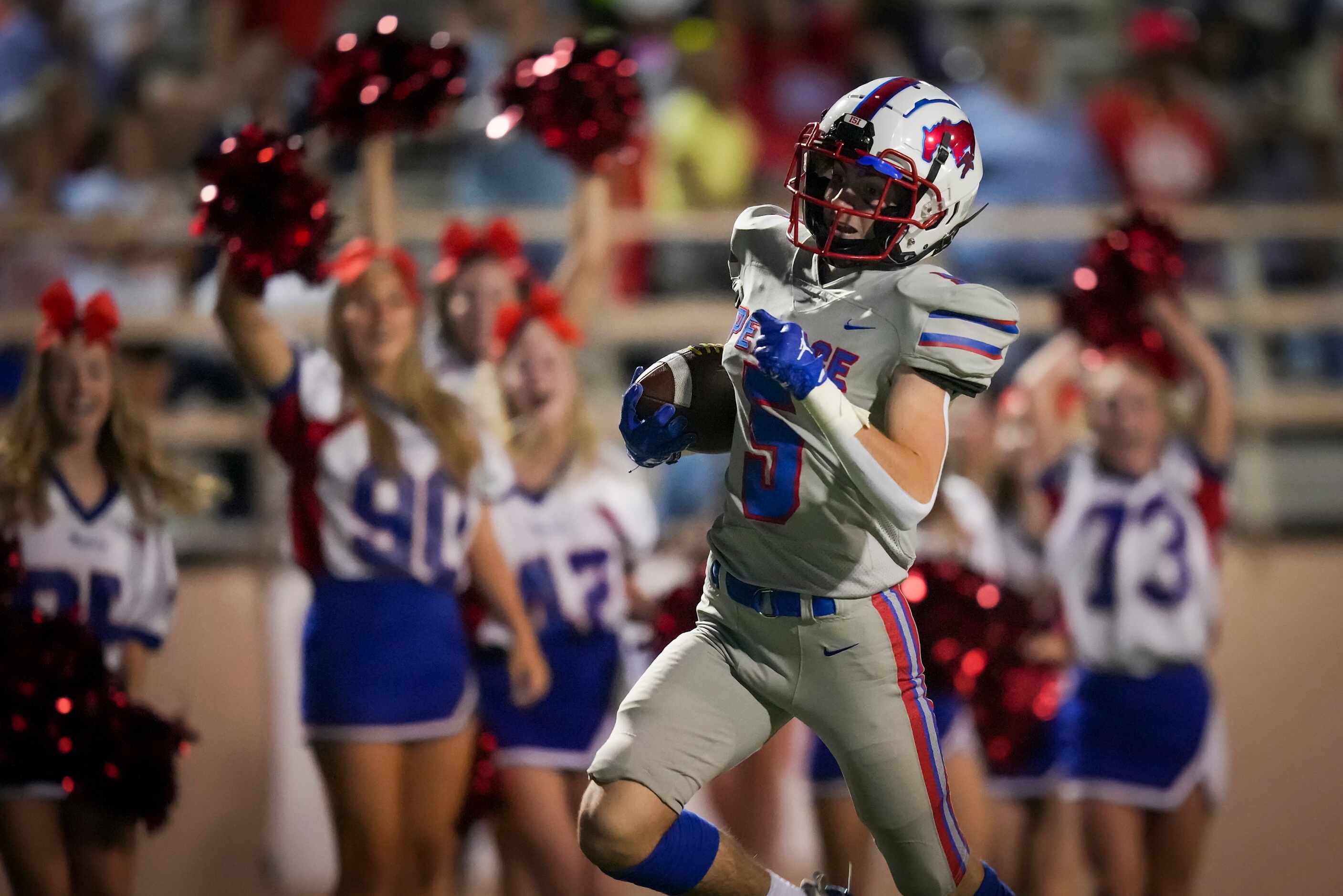 Richardson Pearce’s Jack McGarry (5) raced down the field on a 96-yard kickoff return for a...