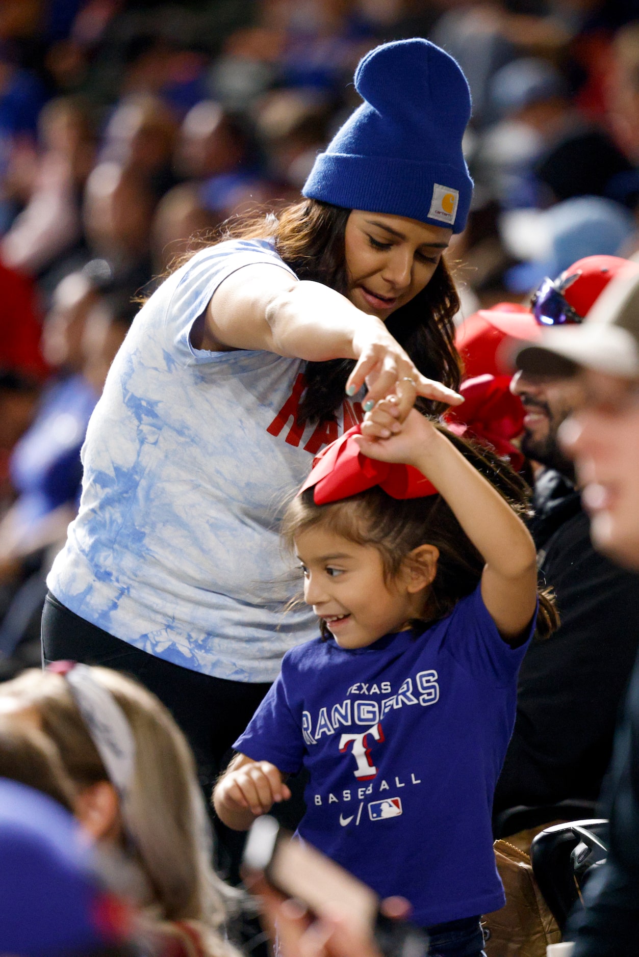 Andie Bazan dances to Selena with her daughter Riley Bazan, 5, during Game 3 of the World...