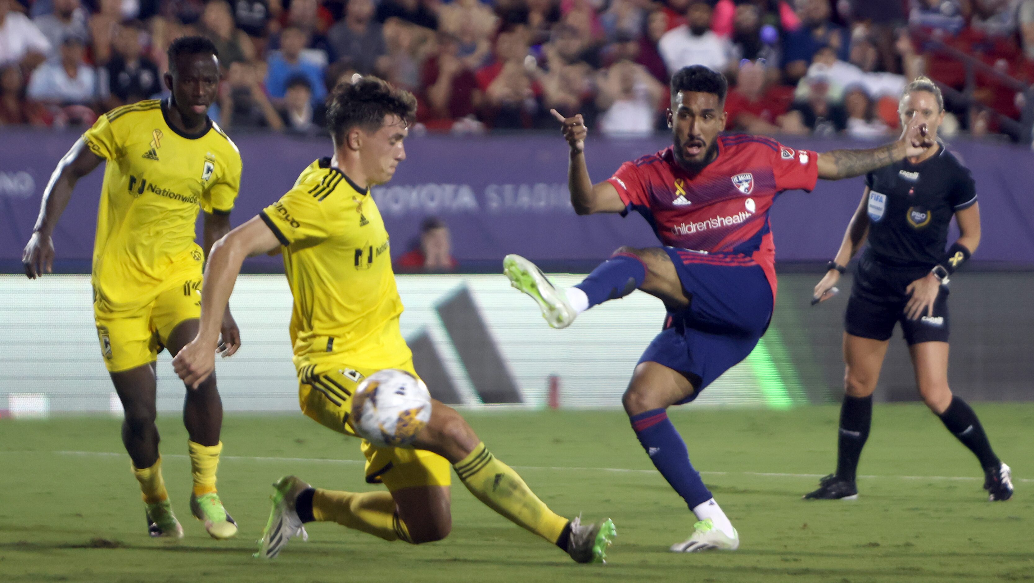 FC Dallas attacker Jesus Ferreira (10) fires a shot on goal against Columbus defender Malte...