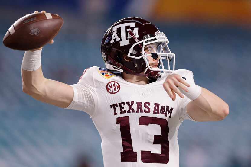 MIAMI GARDENS, FLORIDA - JANUARY 02: Haynes King #13 of the Texas A&M Aggies warms up prior...