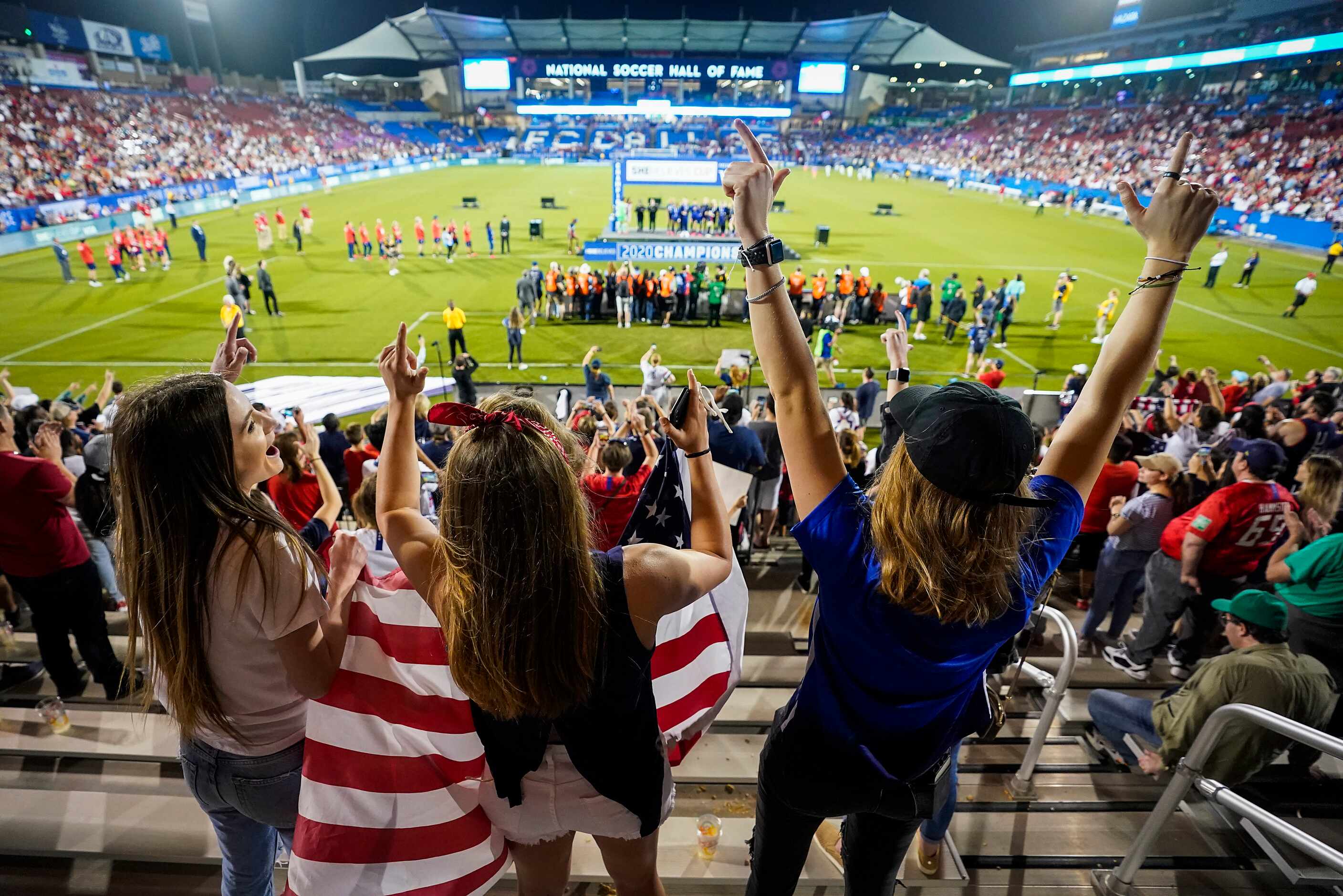 Fans cheer the USA after a victory over Japan in a SheBelieves Cup soccer game on Wednesday,...