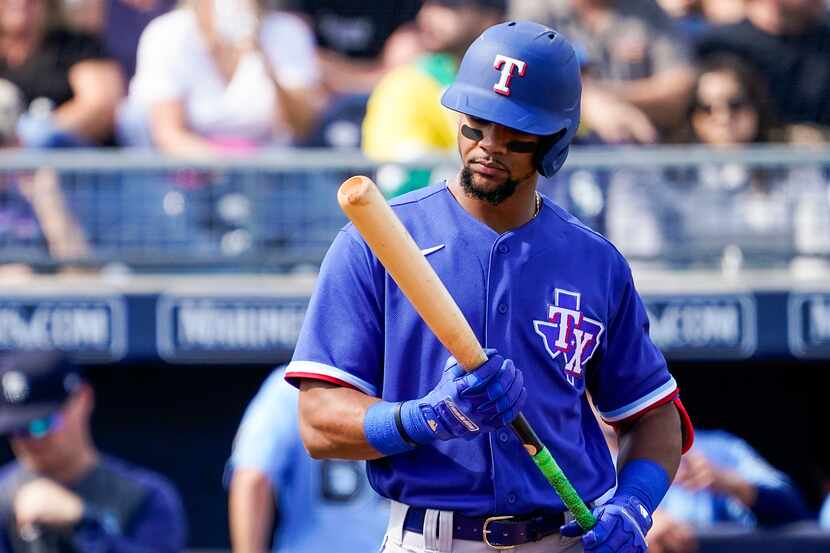 FILE — Texas Rangers outfielder Leody Taveras hits during the second inning of a spring...