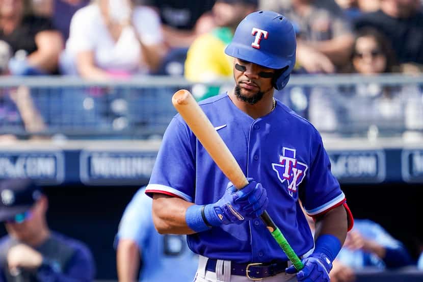 FILE — Texas Rangers outfielder Leody Taveras hits during the second inning of a spring...
