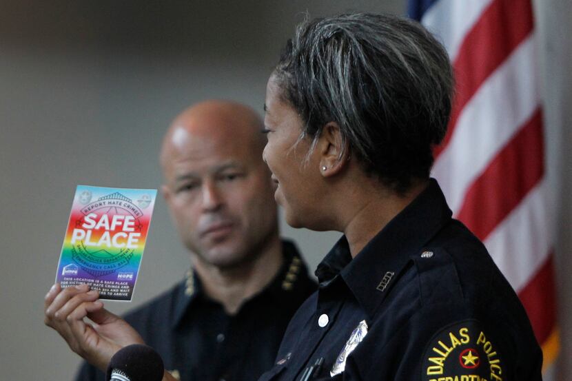 Dallas Police Department's new LGBTQ+ liaison, officer Megan Thomas displays the Safe Place...