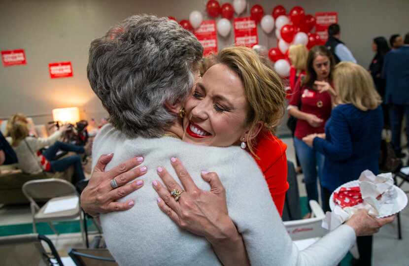 District 32 congressional candidate Genevieve Collins (right) greets Trinka Taylor during an...