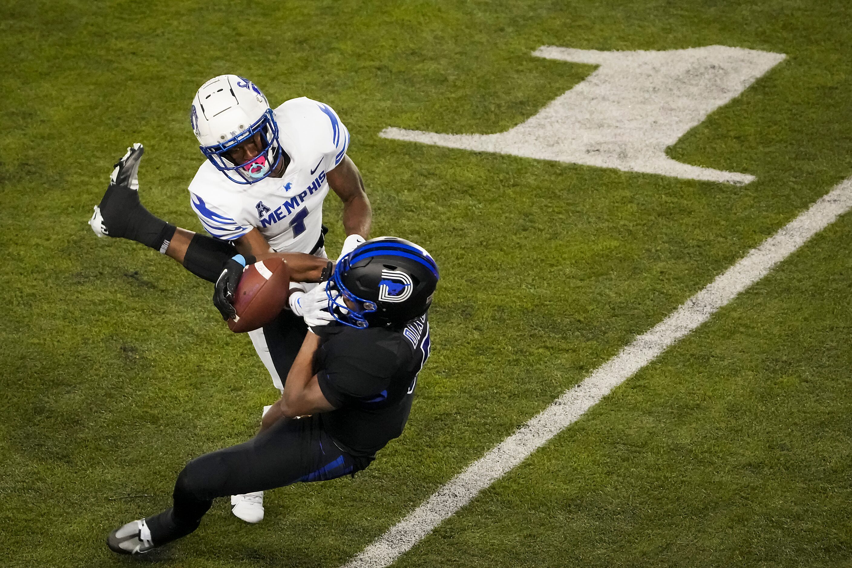 SMU wide receiver Moochie Dixon (5) catches a pass as Memphis defensive back Davion Ross (1)...