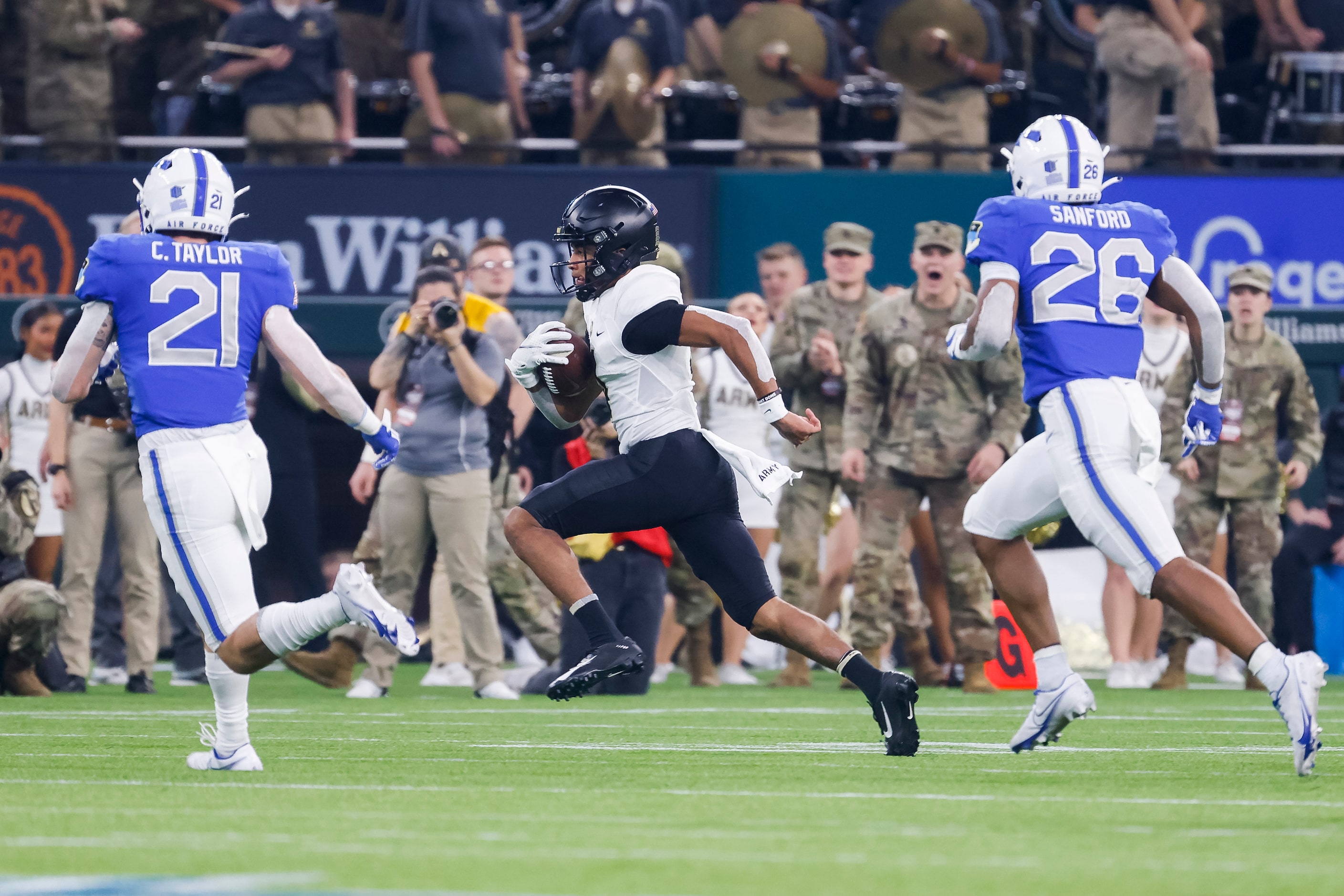 Army Black Knights quarterback Christian Anderson (4) runs for a first down during the...