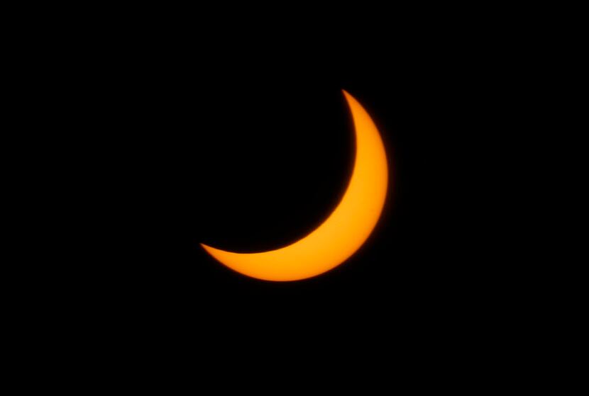 The moon passes in front of the sun at 1:09:51 p.m., the fullest the solar eclipse was seen...