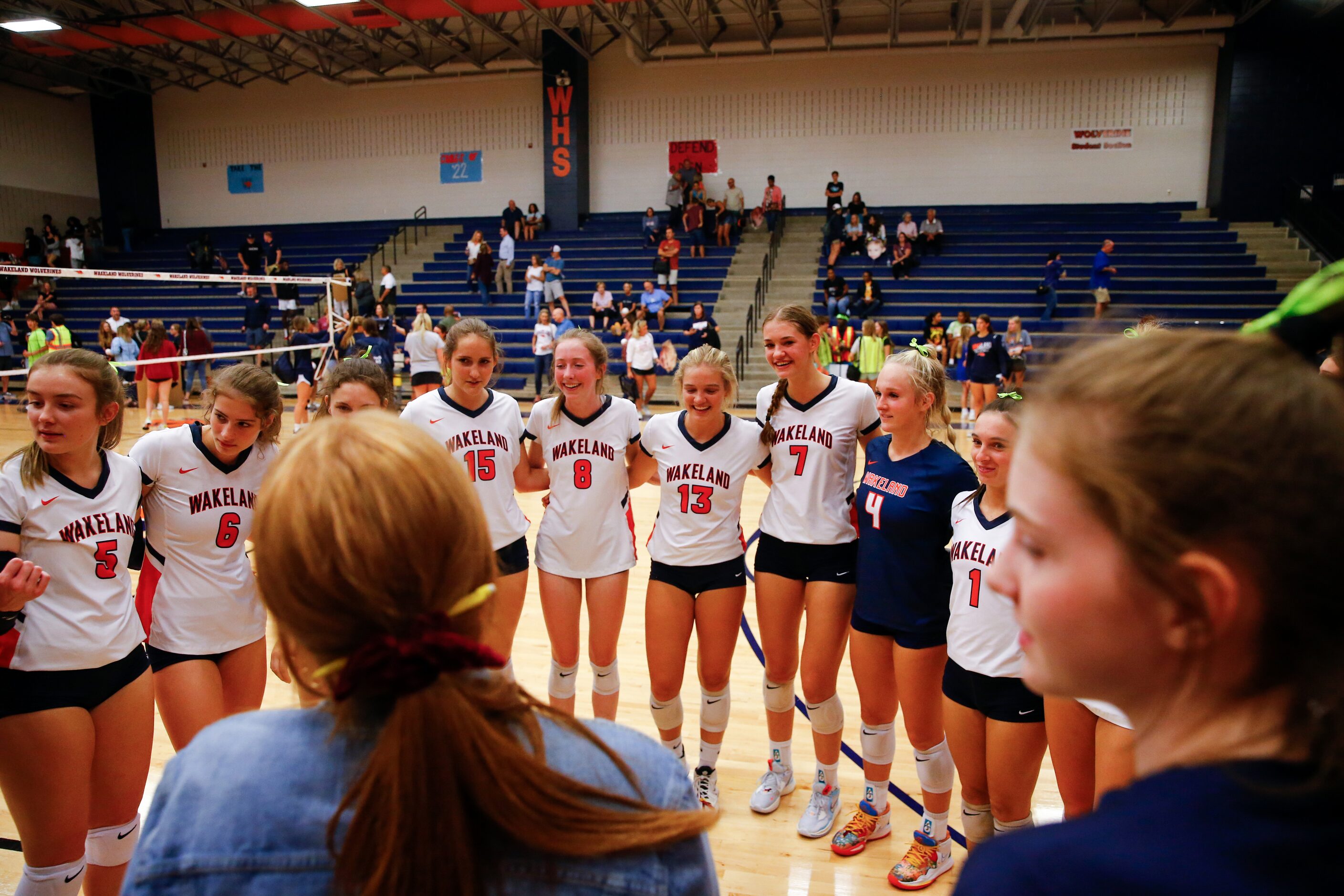 Frisco ISD’s Wakeland High School volleyball team celebrates their win after the third set...