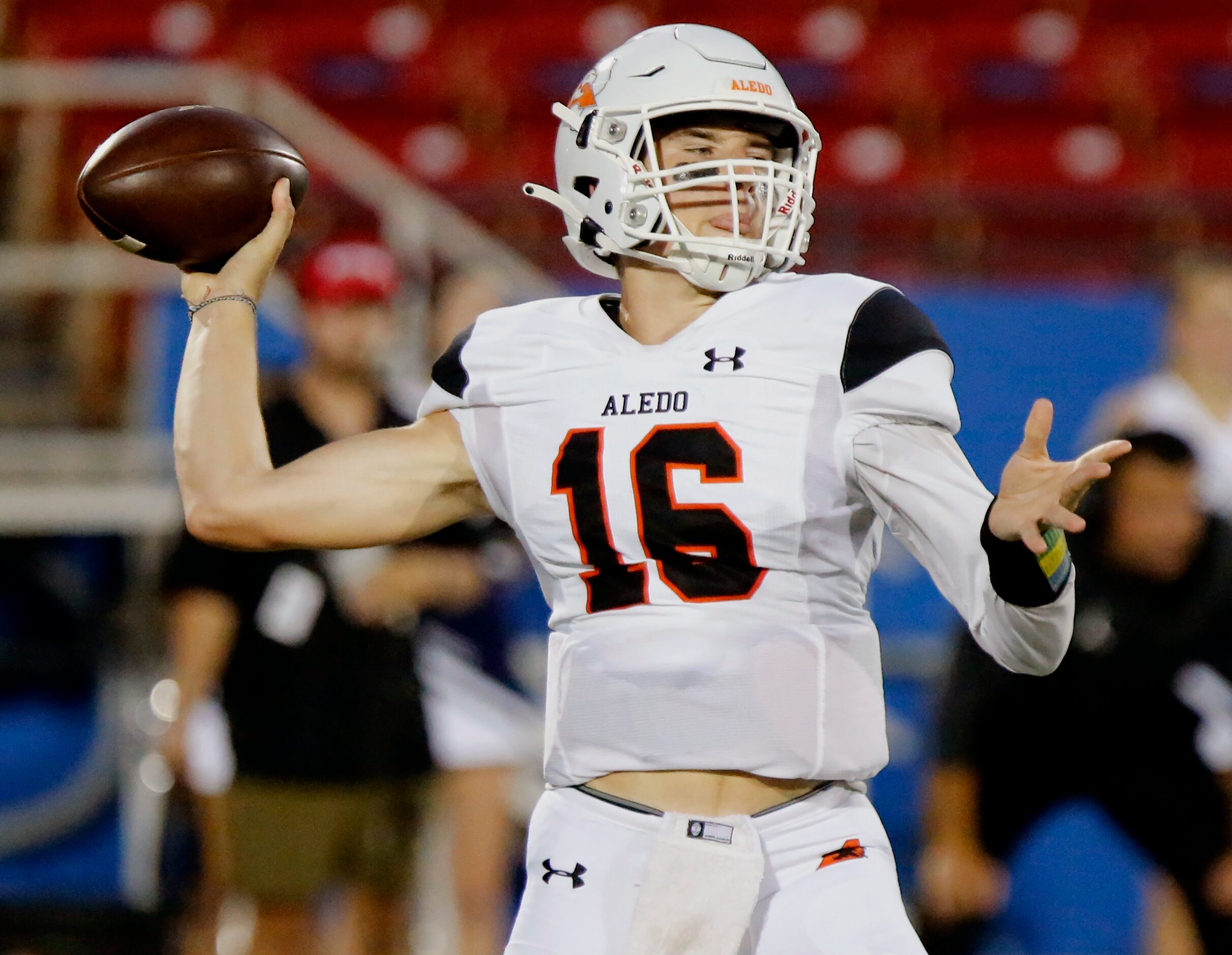 Aledo High School quarterback Brayden Fowler-Nicolosi (16) throws a touchdown pass during...