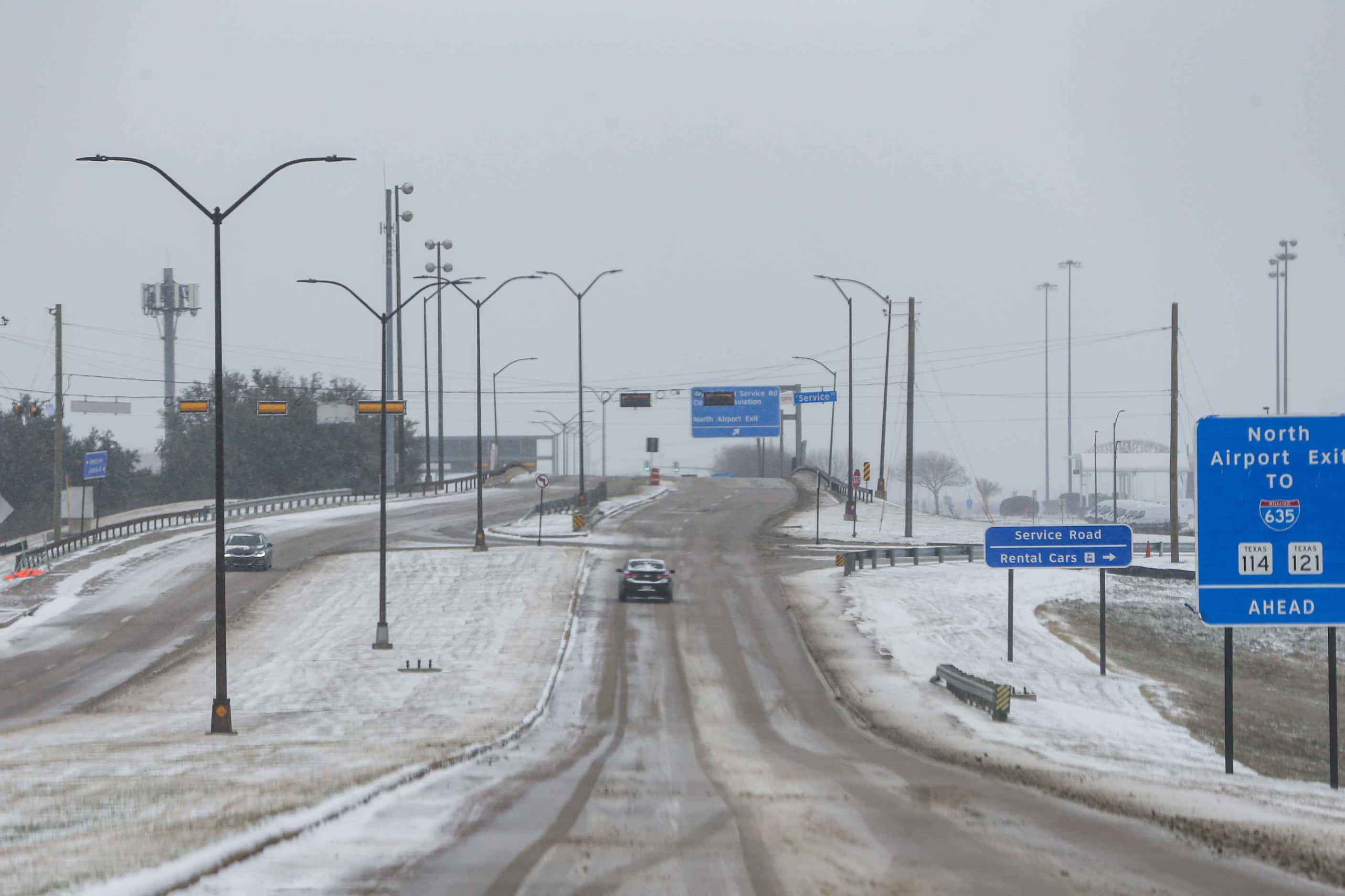 Snow and ice descend over DFW International Airport as American cancel hundreds of flights...