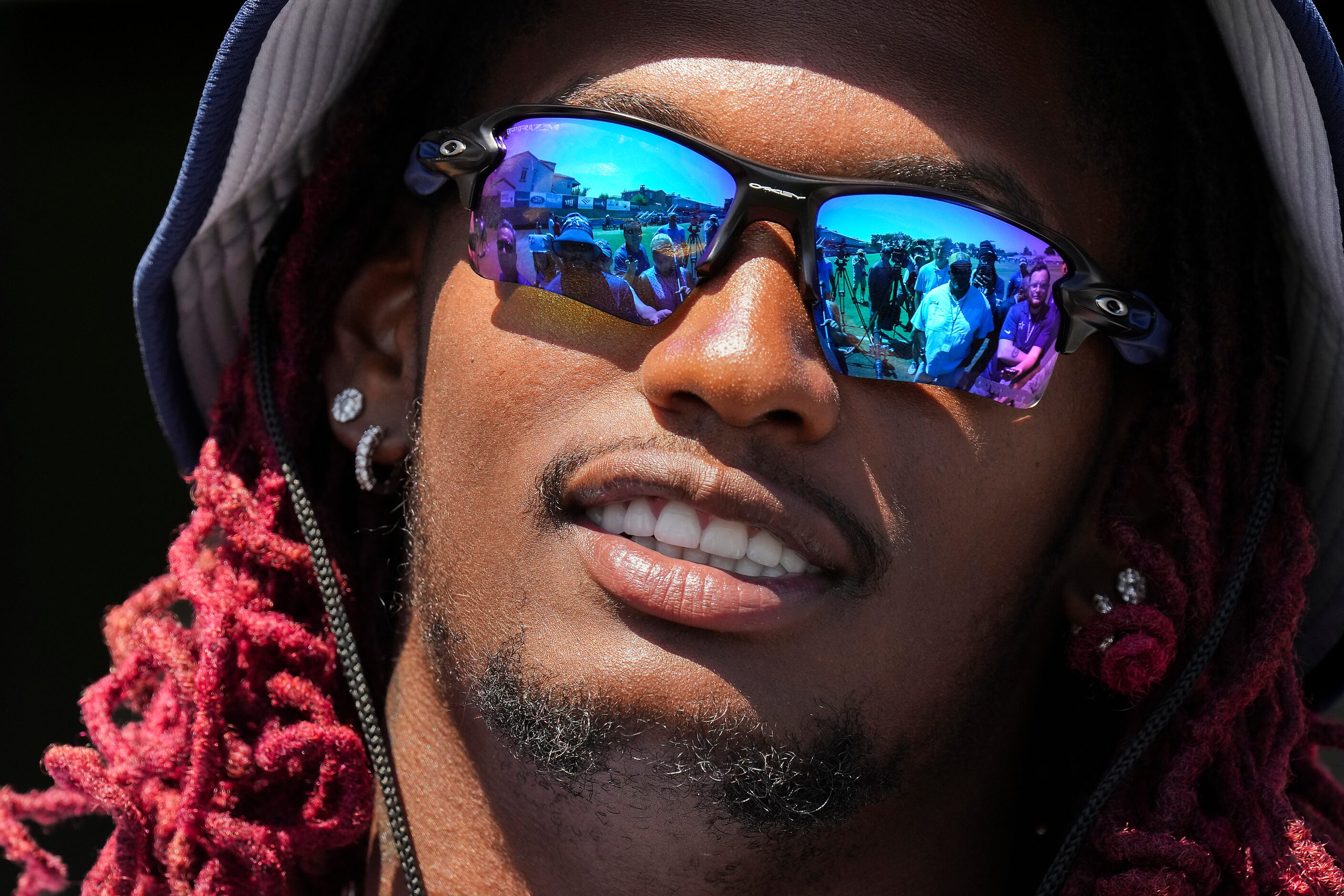 Dallas Cowboys wide receiver CeeDee Lamb talks with reporters after a training camp...