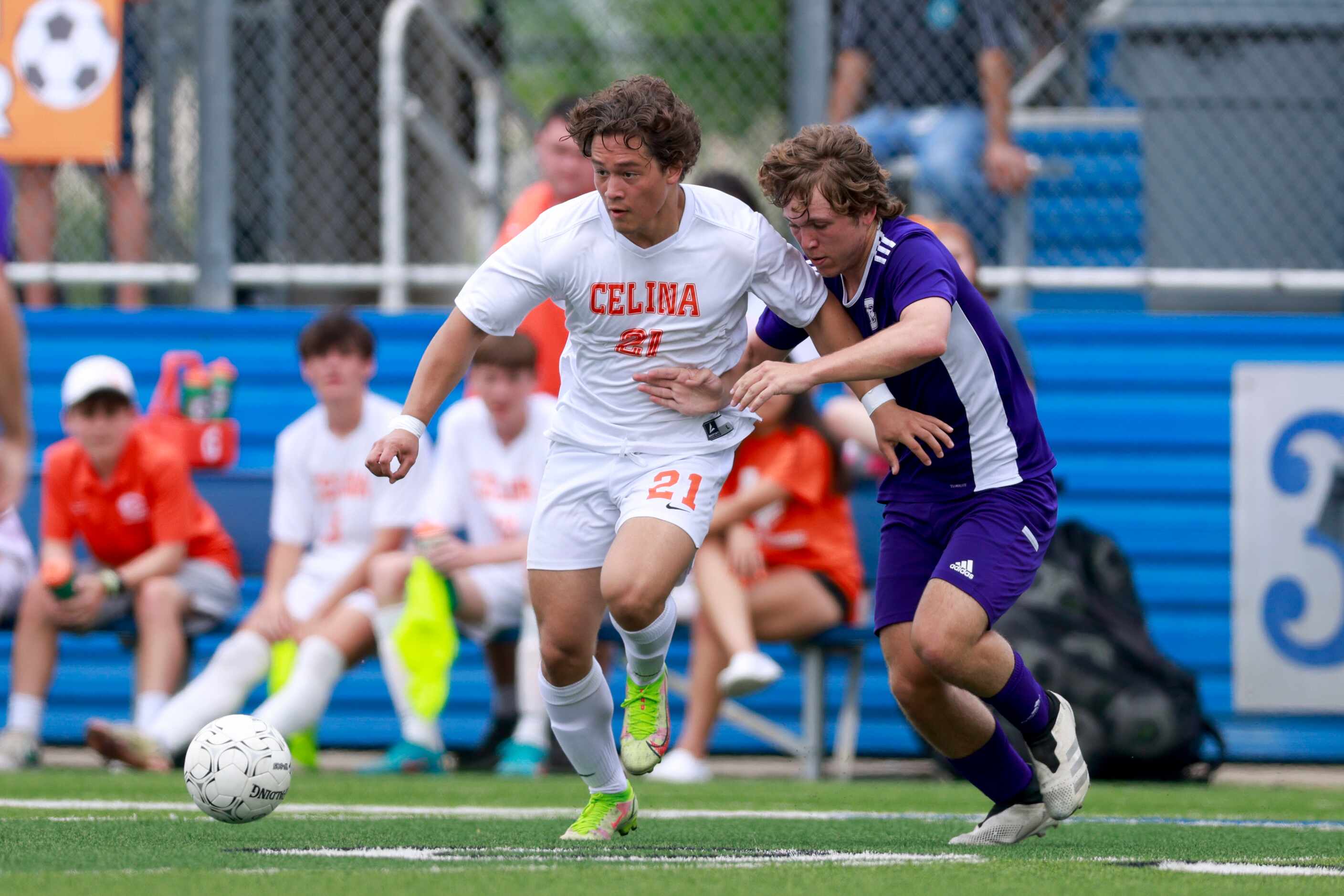 Celina forward Troy Peterson (21) dribbles the ball away from Boerne’s Logan Walter (13)...