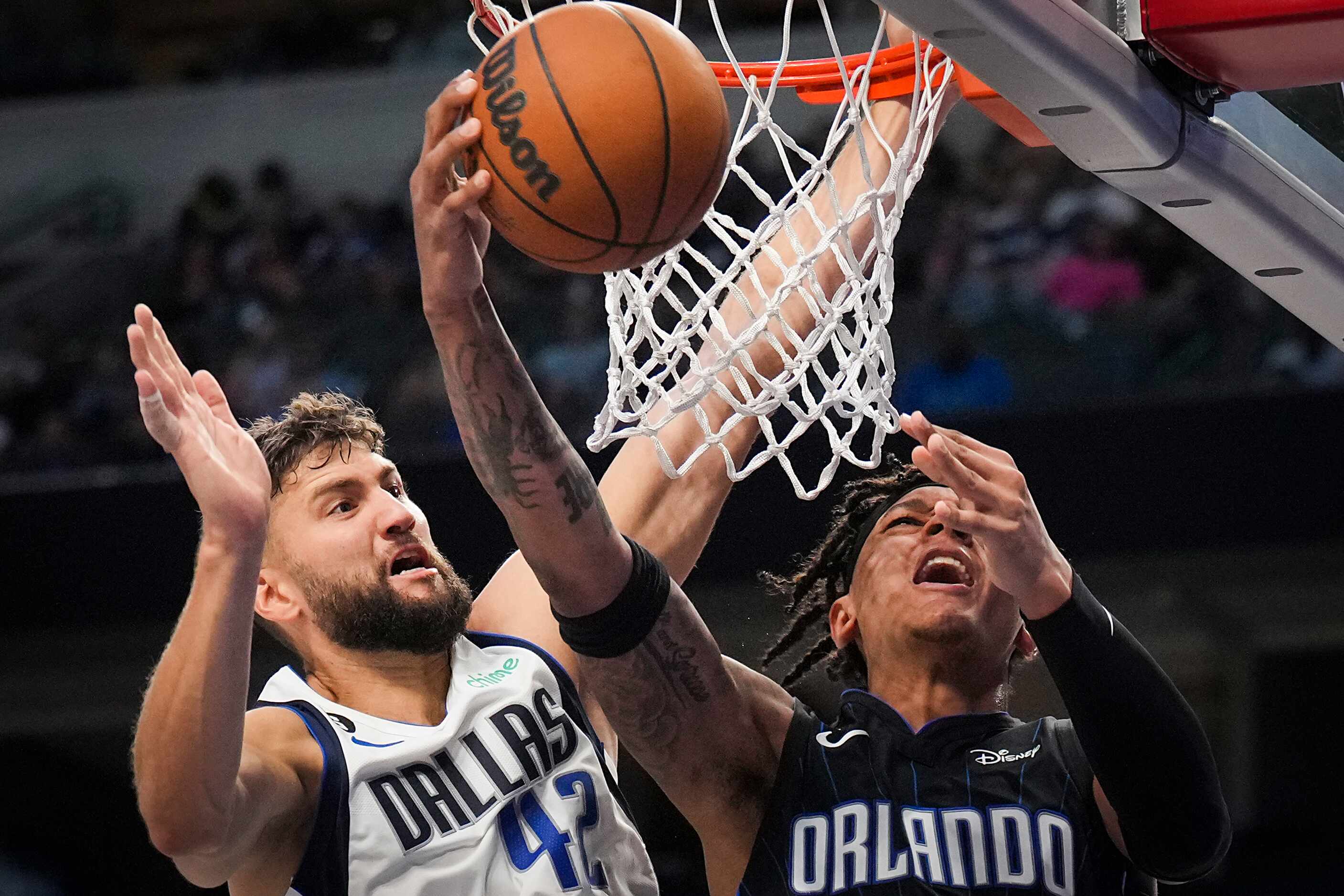 Orlando Magic guard Cole Anthony (50) is fouled by Dallas Mavericks forward Maxi Kleber (42)...