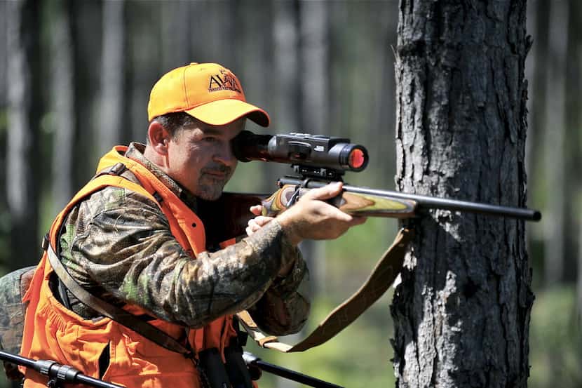 ORG XMIT: XNYT34 Dennis Moser hunts for deer at the Whitetail Pro Series hunting tournament...
