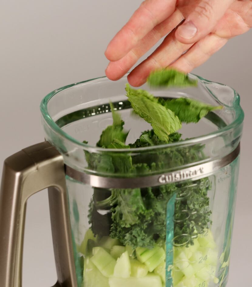 The making of a kale, cucumber and mint smoothie