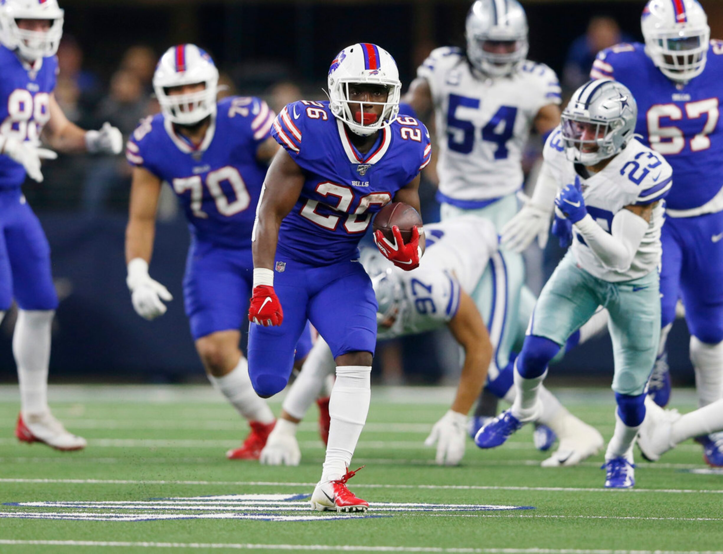 Buffalo Bills running back Devin Singletary (26) runs up the field as the Dallas Cowboys...