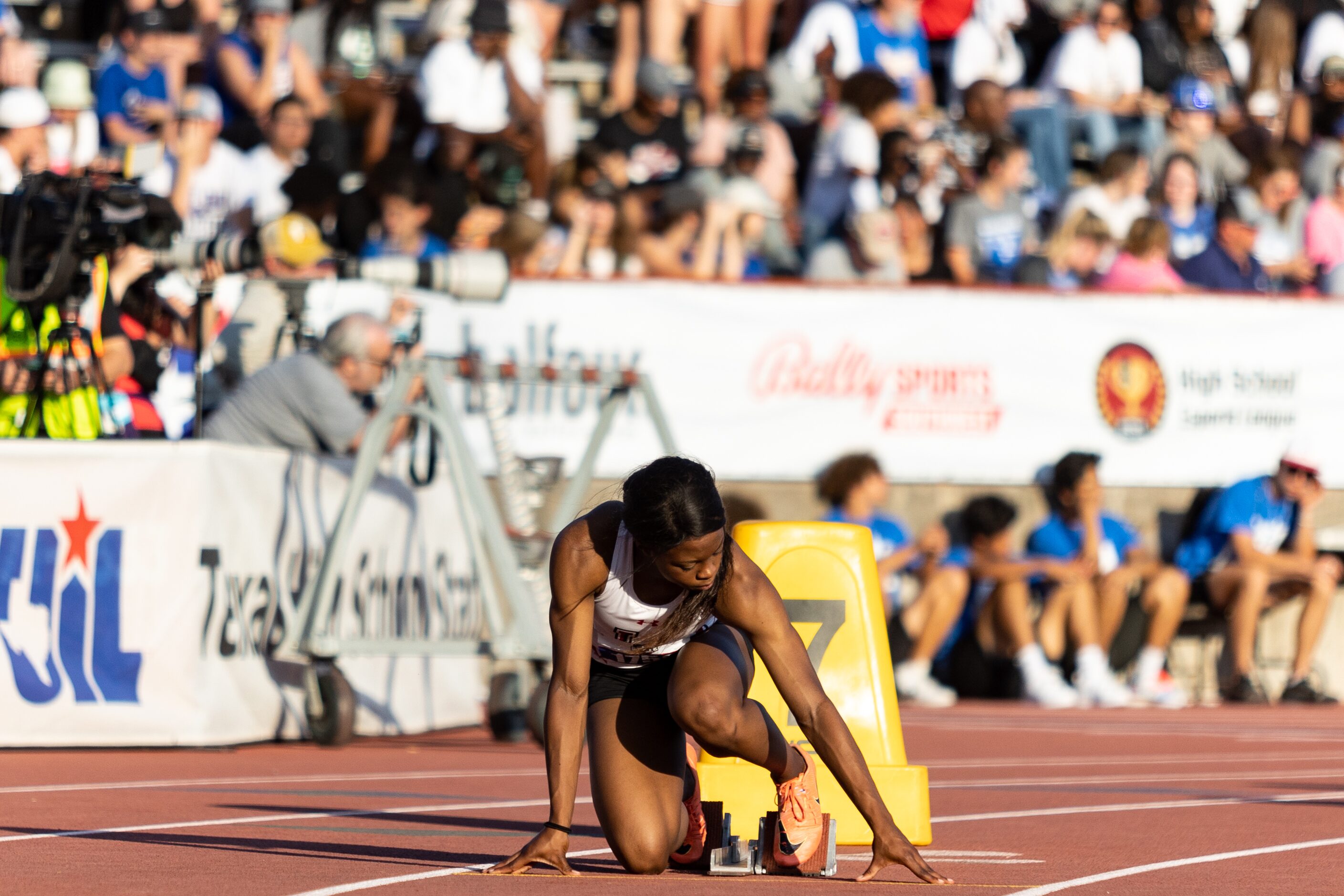 Christine Mallard of Mansfield Legacy prepares at the starting blocks for the girls’ 400m...