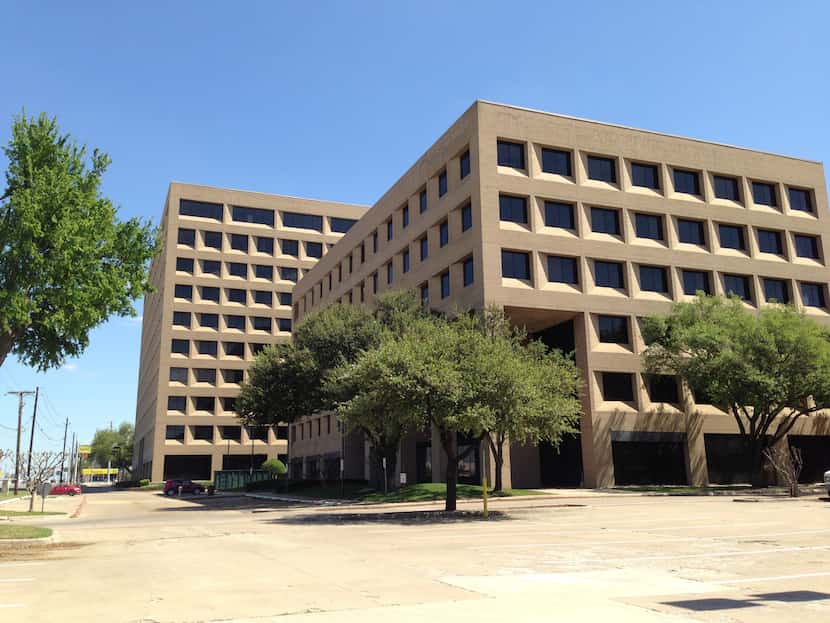 The LBJ Financial Center — built starting in the late 1970s — has large surface parking lots...