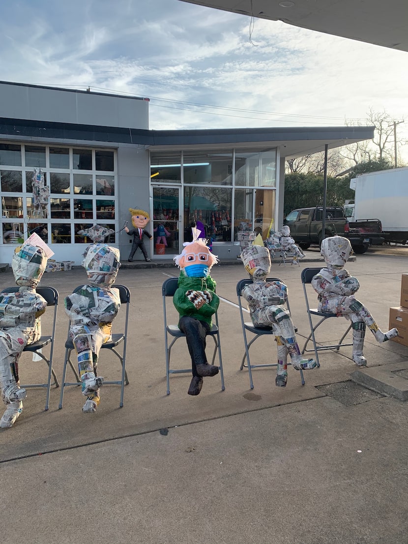 A Bernie Sanders piñata sits beside others in earlier stages of production outside ABC Party...