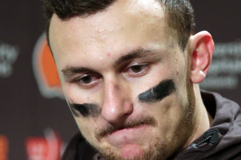 Cleveland Browns quarterback Johnny Manziel speaks with media members following the team's...