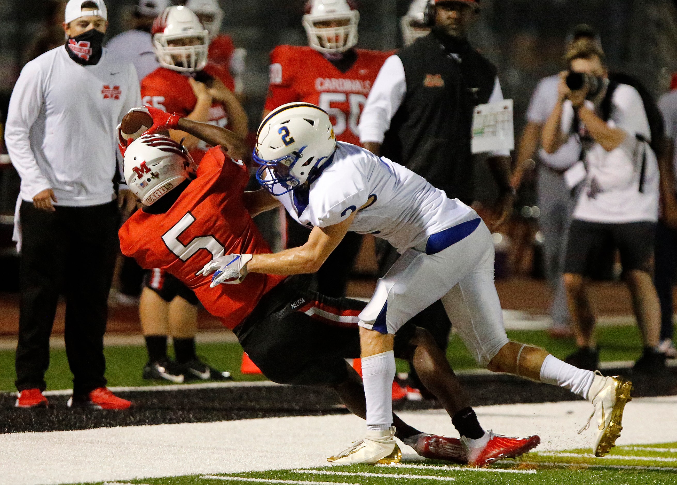 Melissa High School wide receiver Antonio Robinson (5) was ruled in bounds for a 40 yard...