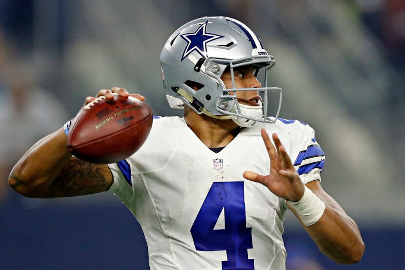 Dallas Cowboys quarterback Dak Prescott passes during the first half of Dallas' 31-17 win...