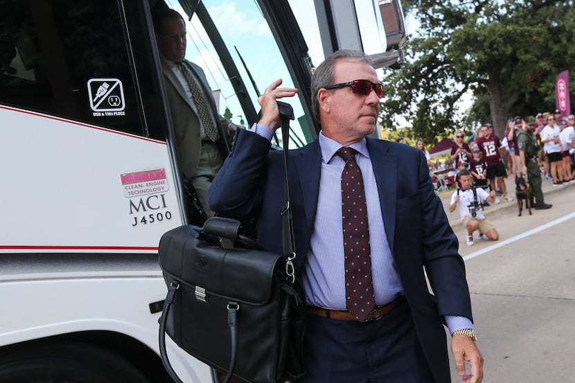 Texas A&M Aggies head coach Jimbo Fisher arrives with the team prior to a college football...