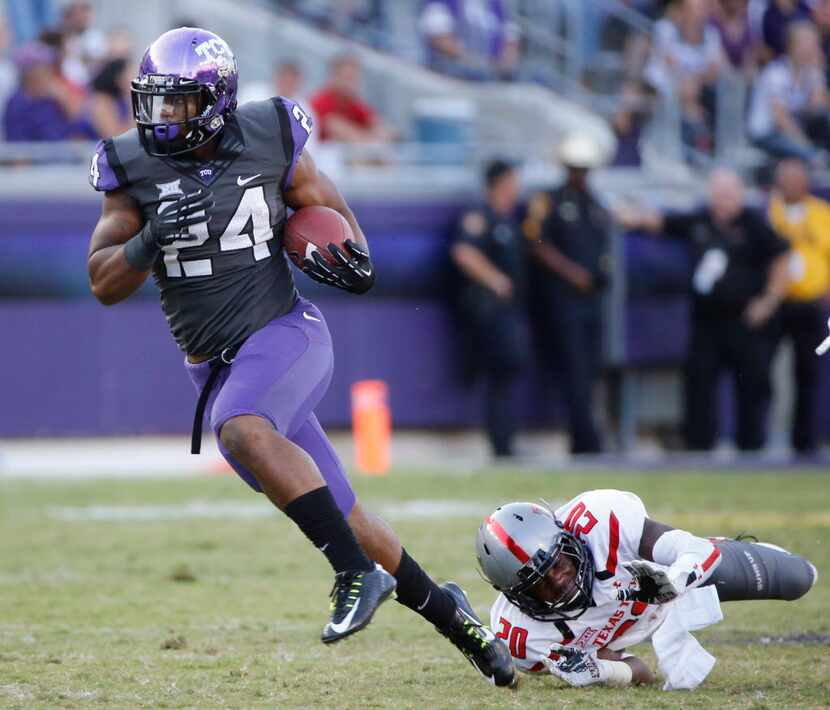 TCU running back Trevorris Johnson (24) breaks free from an attempted tackle by Texas Tech...