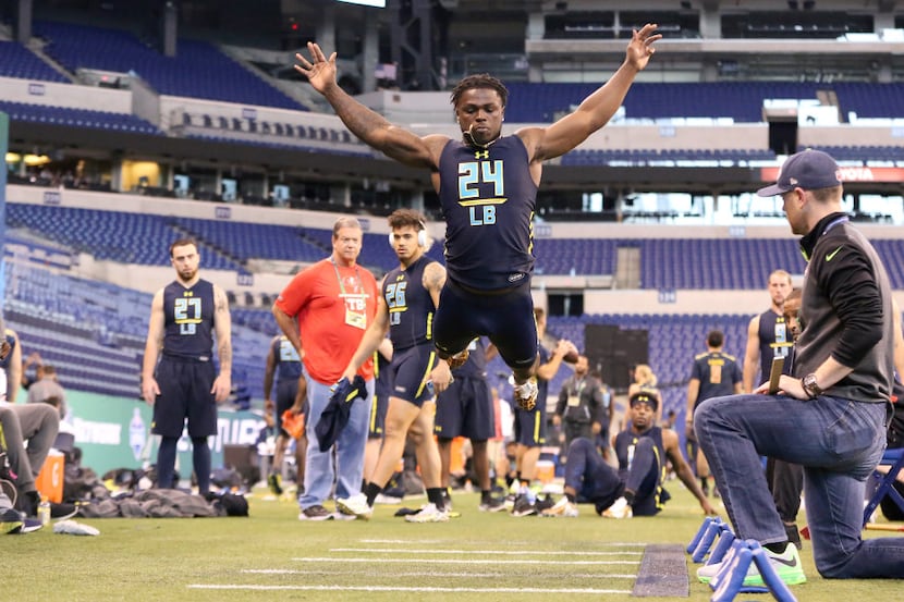 Michigan linebacker Jabrill Peppers competes in the broad jump at the 2017 NFL football...