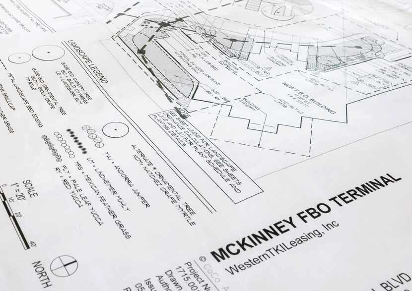Plans for the expansion of McKinney National Airport sit on a desk at the new facility on...