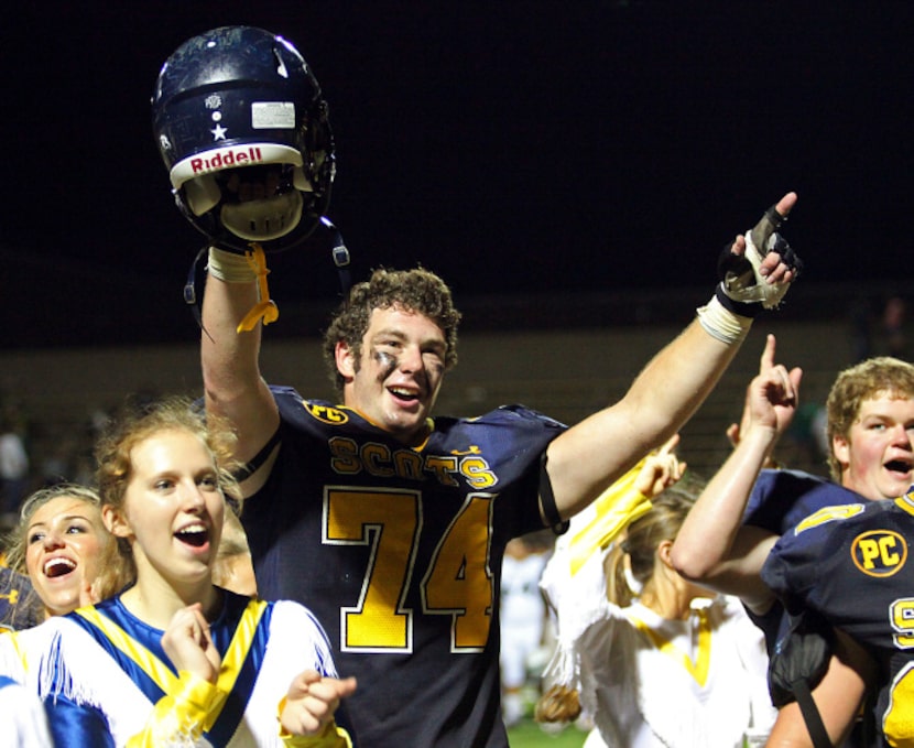 Highland Park High School offensive lineman Tony Richards (74) celebrates a 41-26 victory...