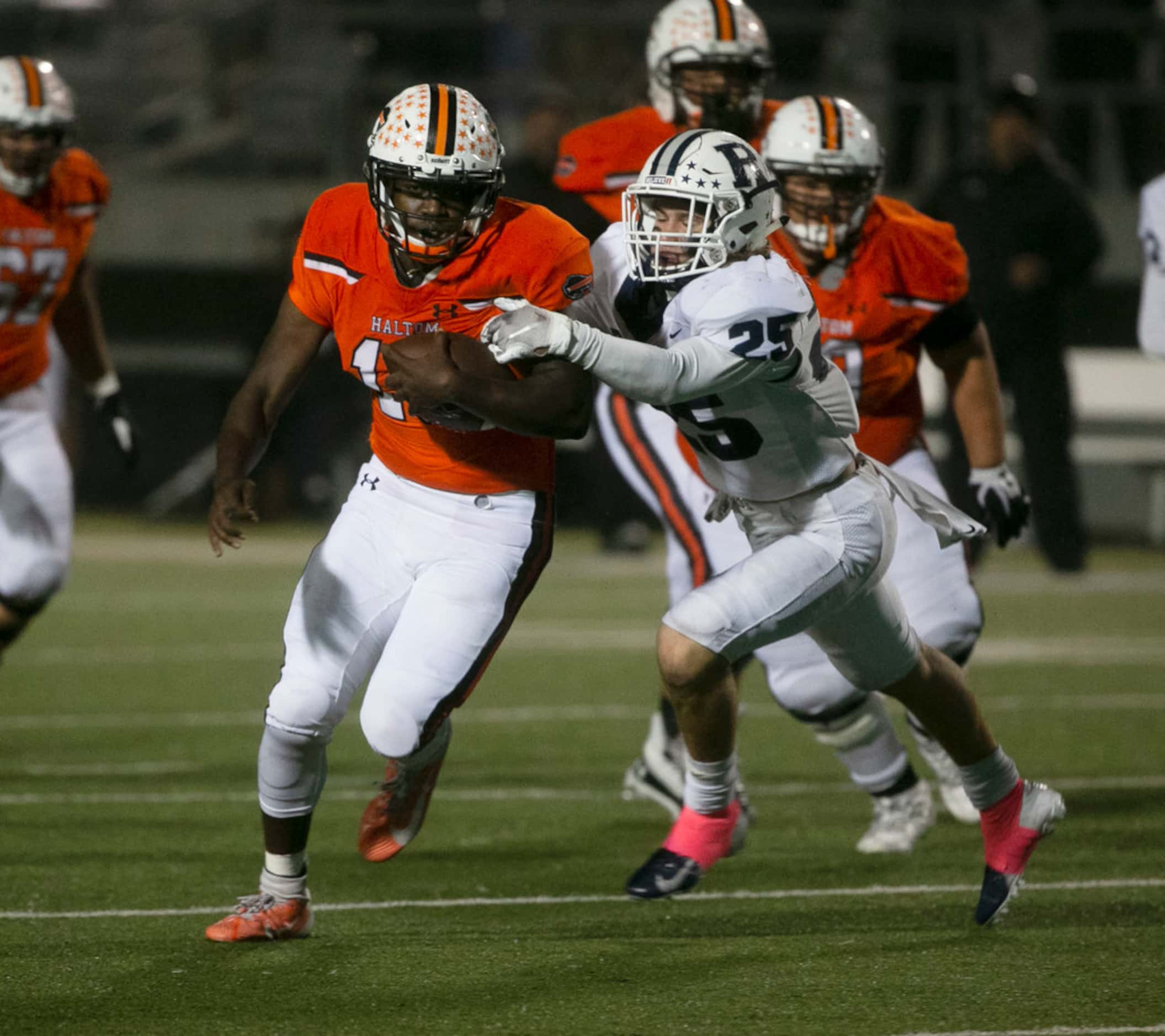 Haltom's Adam Hill (10) tries to get away from Richland's Ethan Heinrich  (25) during the...