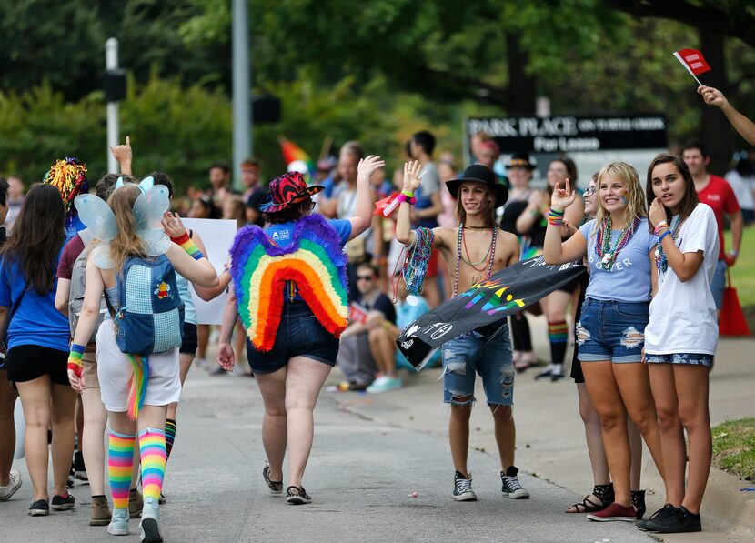 Spectators cheered on the Alan Ross Texas Freedom Parade near its end point at Reverchon Park.