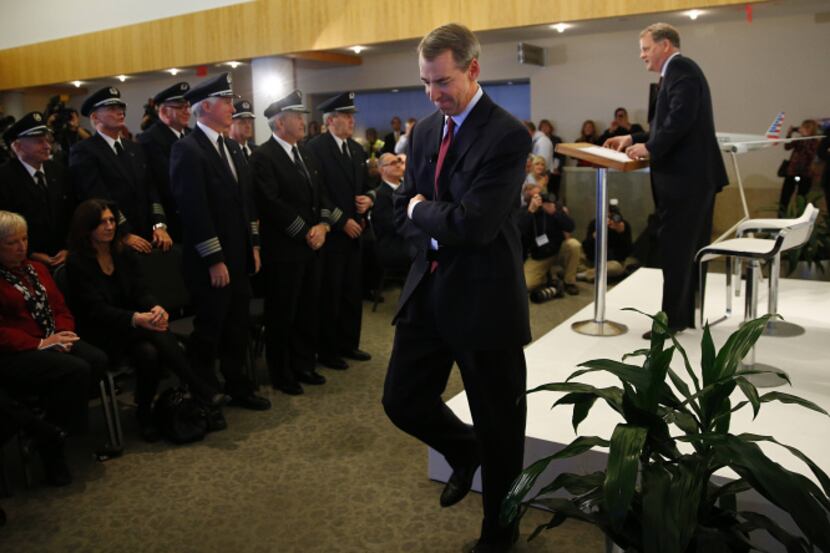As American Airlines CEO Tom Horton stepped off the stage, US Airways CEO Doug Parker took...