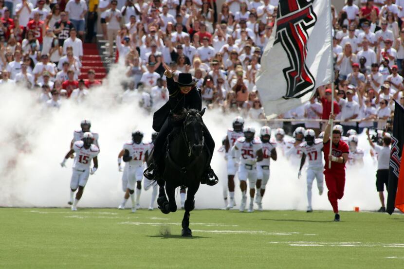 Sep 12, 2015; Lubbock, TX, USA; The Texas Tech Red Raiders masked rider brings the Red...