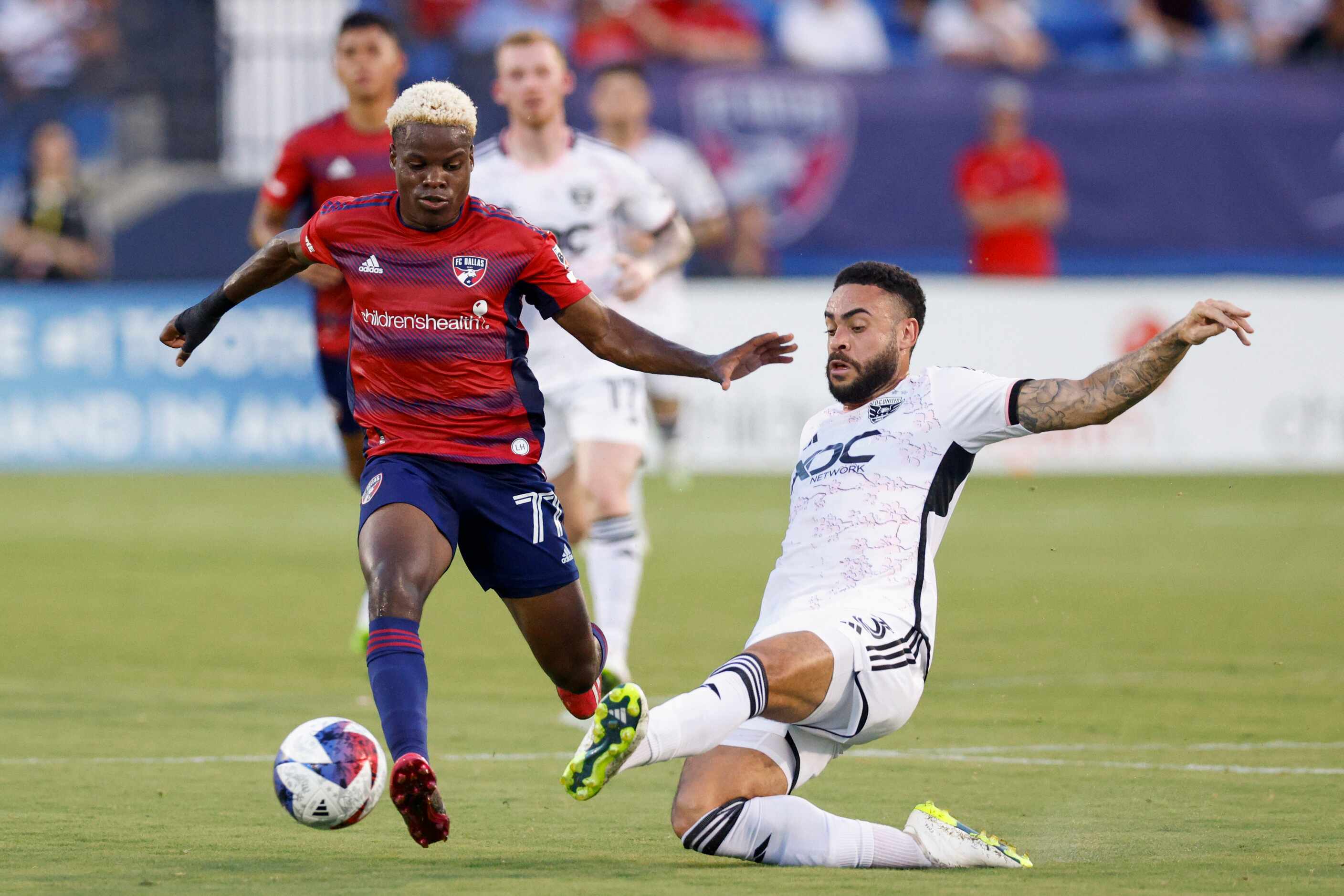 D.C. United defender Derrick Williams (3) slides as he tries to knock the ball away from FC...
