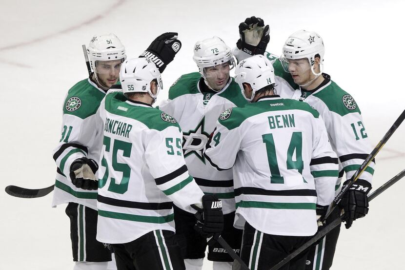 Dallas Stars left wing Jamie Benn (14) is congratulated on his goal in the second period of...