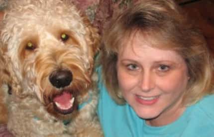  Teri Holamon and her Goldendoodle Gibbs enjoy reading together. (Photo submitted by Teri...
