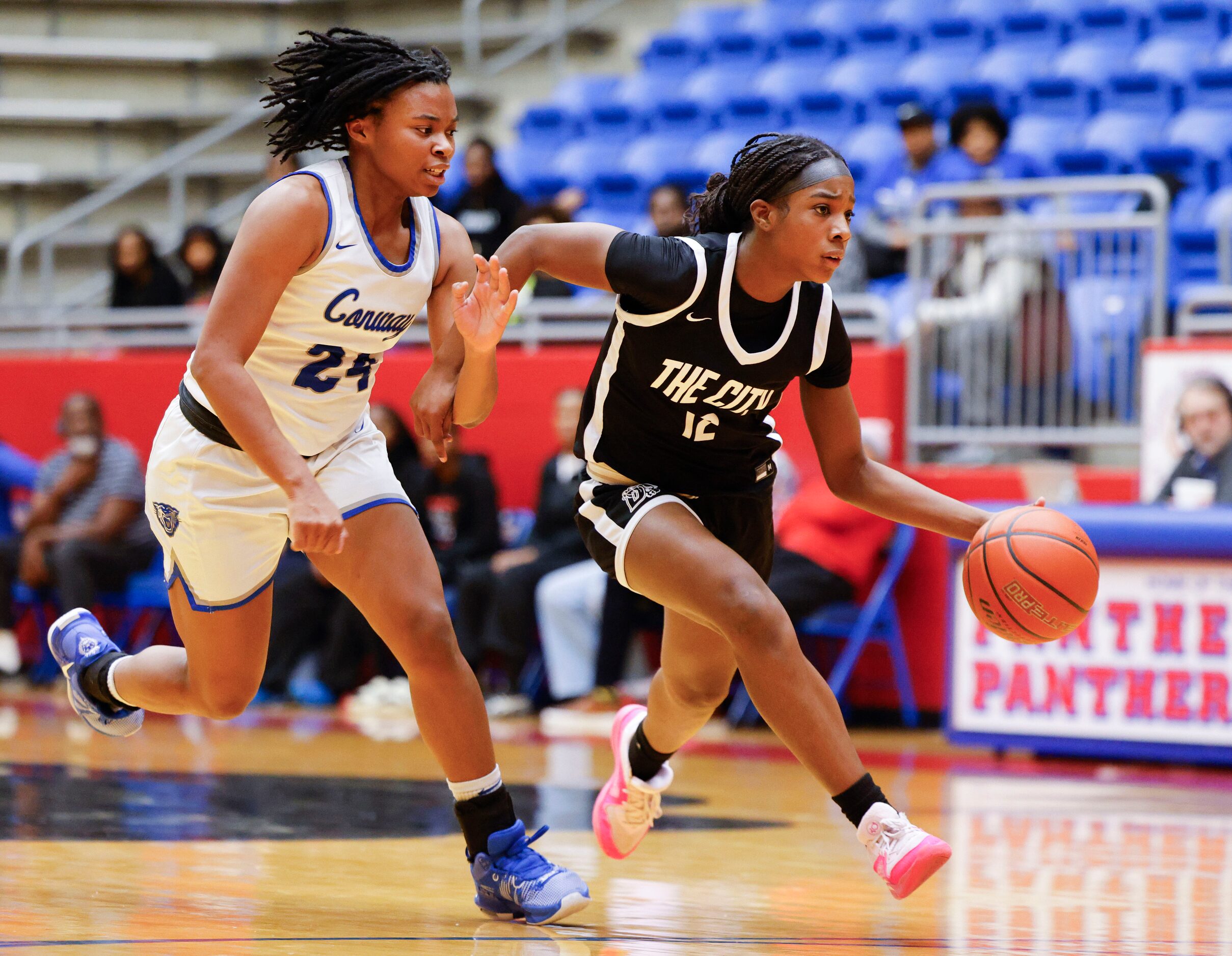 Conway’s Alexis Cox  (left) tries to stop Duncanville high’s Kaylinn Kemp during the first...