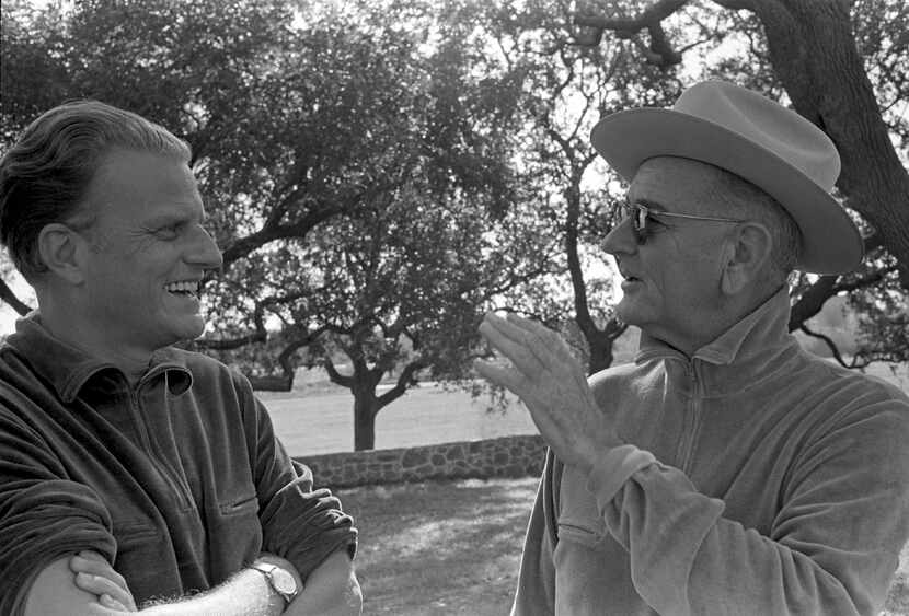 The Rev. Billy Graham and President Lyndon B. Johnson visit at the LBJ Ranch near Stonewall...