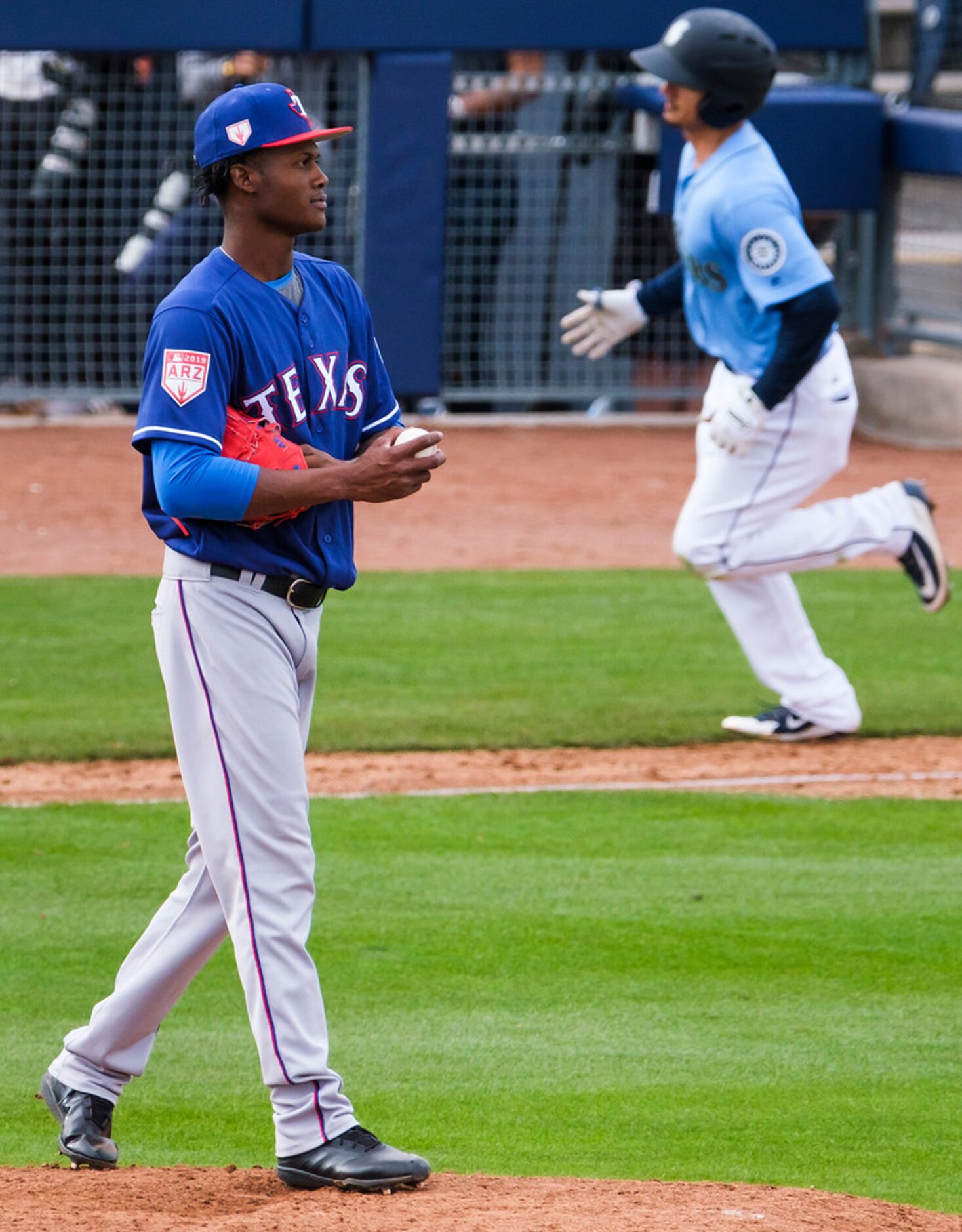 Seattle Mariners second baseman Chris Mariscal rounds the bases after hitting a home run off...