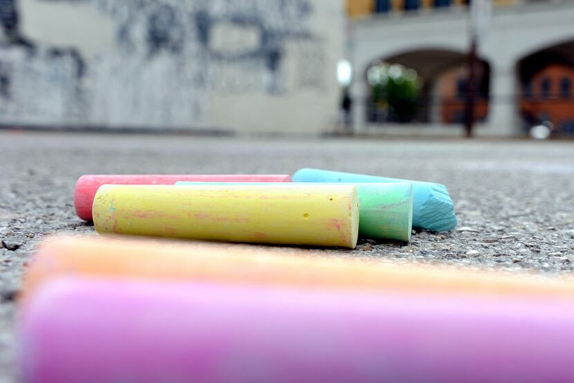 Event organizers supplied chalk for participants in Chalk-tober Fest on Sunday in Dallas. 