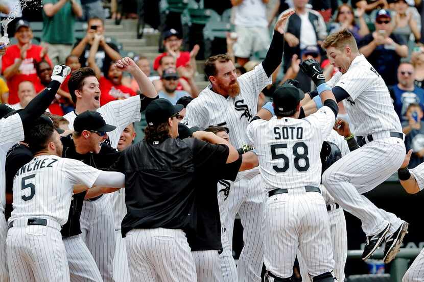 CHICAGO, IL - JUNE 21: Gordon Beckham #15 of the Chicago White Sox leaps into the air as he...