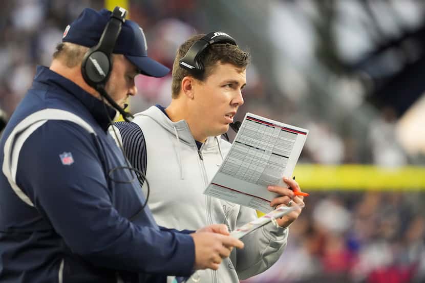 Dallas Cowboys offensive coordinator Kellen Moore works on the sidelines with head coach...
